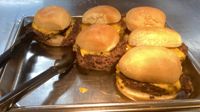 burgers on metal platter