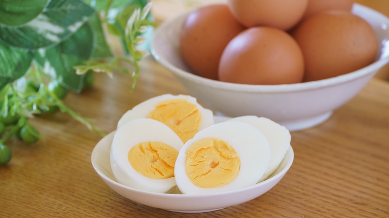 halved hard-boiled and whole eggs