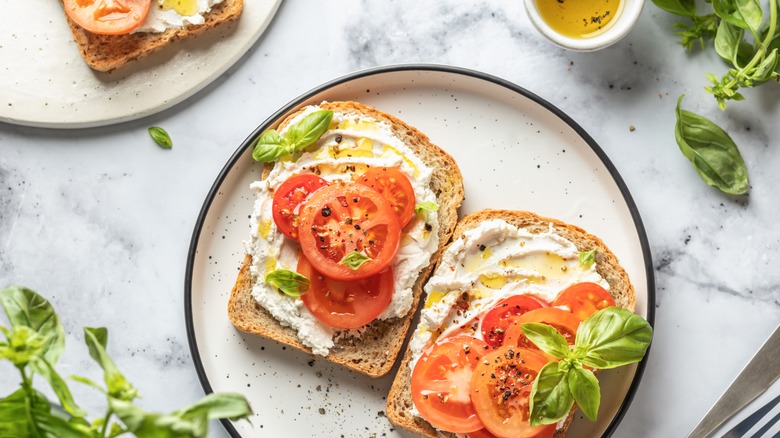 open tomato sandwich with cream