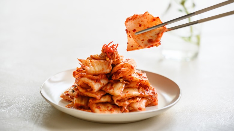 kimchi on plate and chopsticks