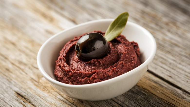 olive tapenade in white bowl