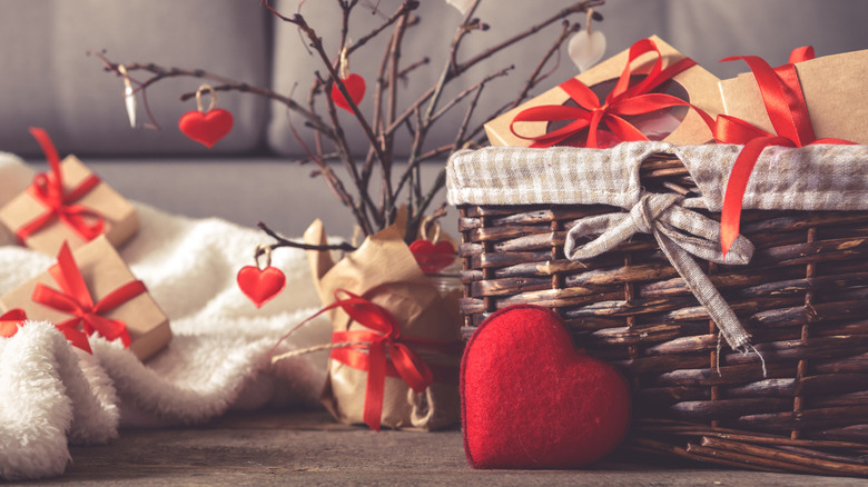 A basket filled with gifts and hearts