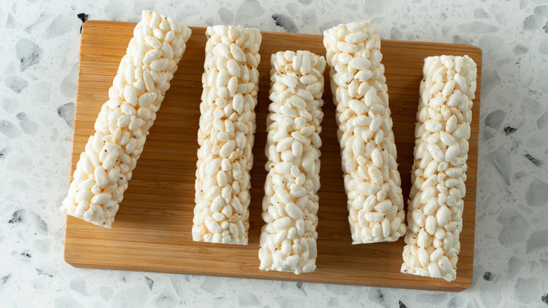 overhead of rice roll snack on wooden board