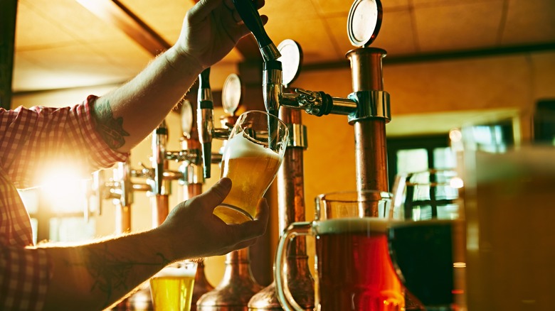 bartender pouring drafts