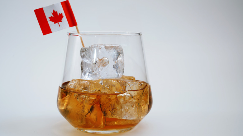 whiskey on ice with mini Canadian flag