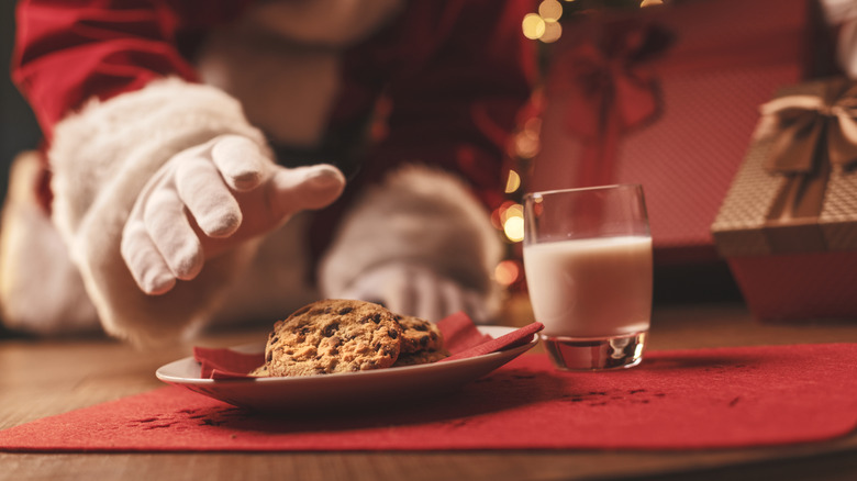 Santa hand reaching for a cookie