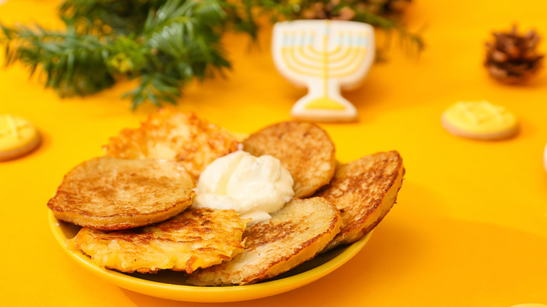 latkes with pine boughs, gelt, and menorah cookie