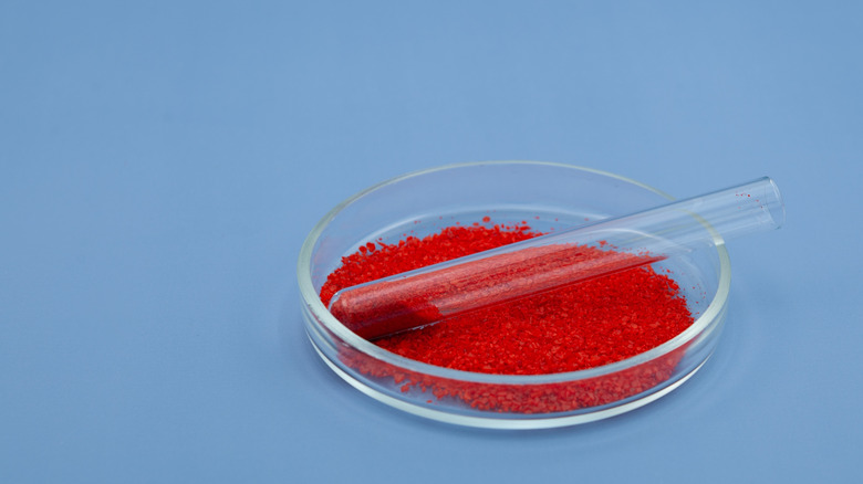 red food dye on a glass petri dish