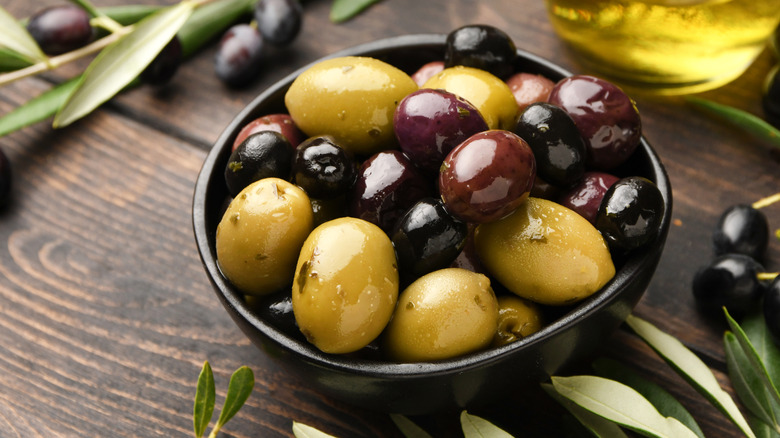 assorted olives in a black bowl