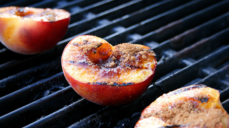 Peach halves on grill