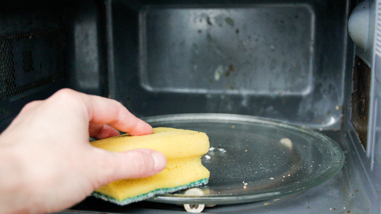 hand wiping microwave turntable