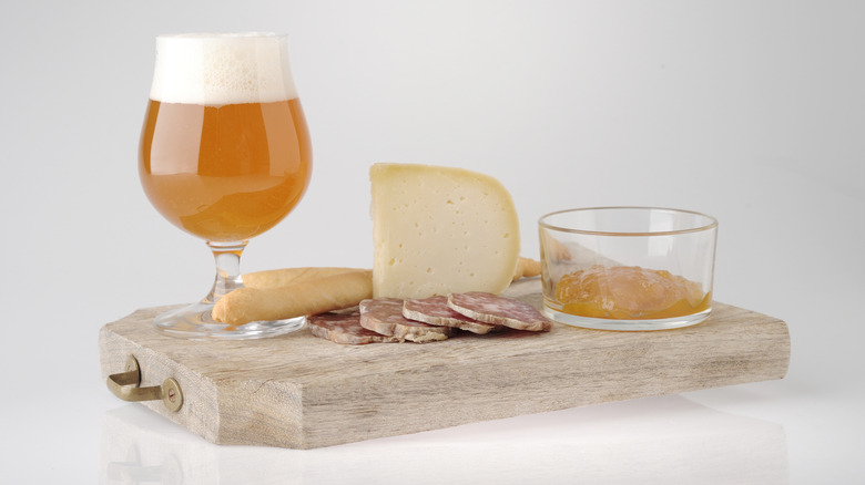 Beer jelly with beer and cheese on wooden board