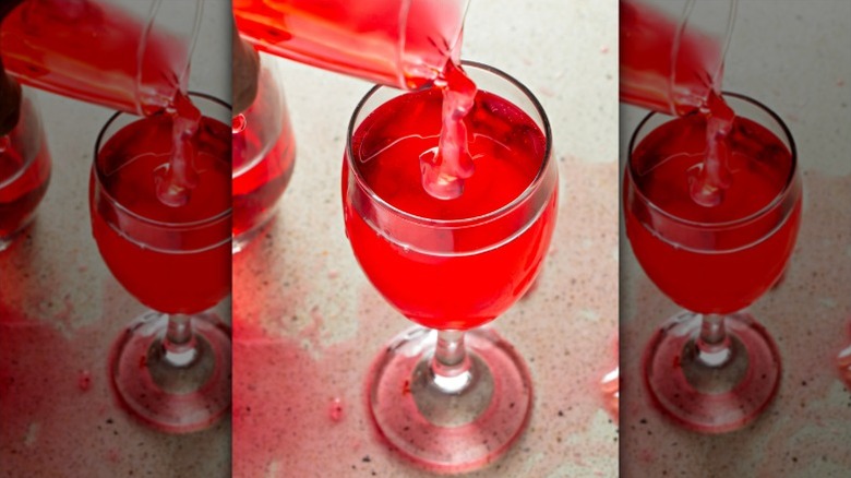 Wine jelly being poured into a wine glass