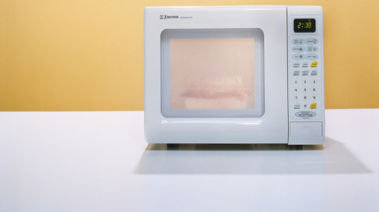 white microwave on a white countertop