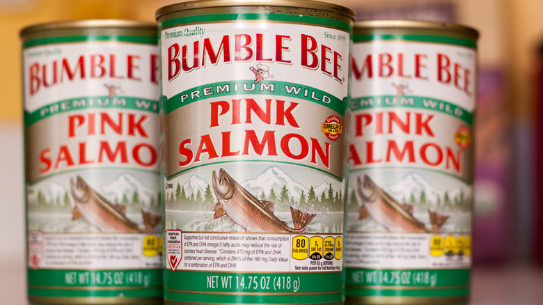 Three cans of Bumble Bee pink salmon