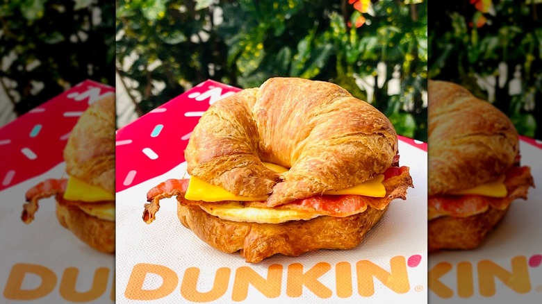 Dunkin' croissant breakfast sandwich on table