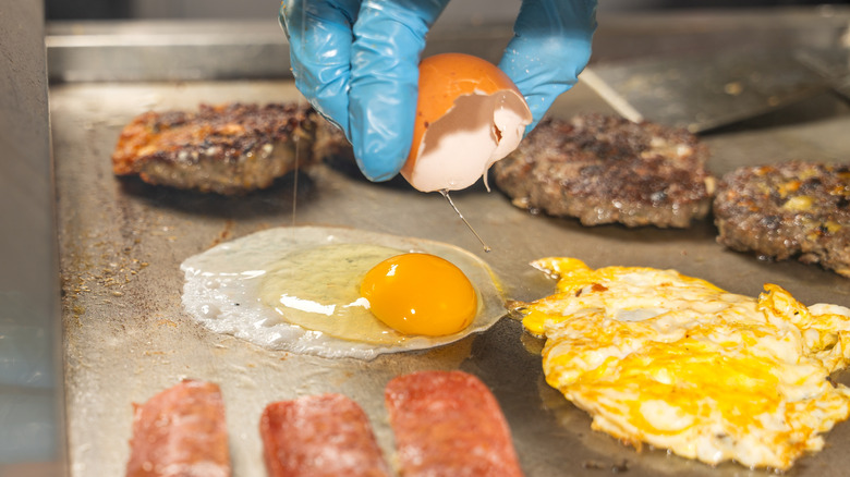 Fast food cook preparing egg dish