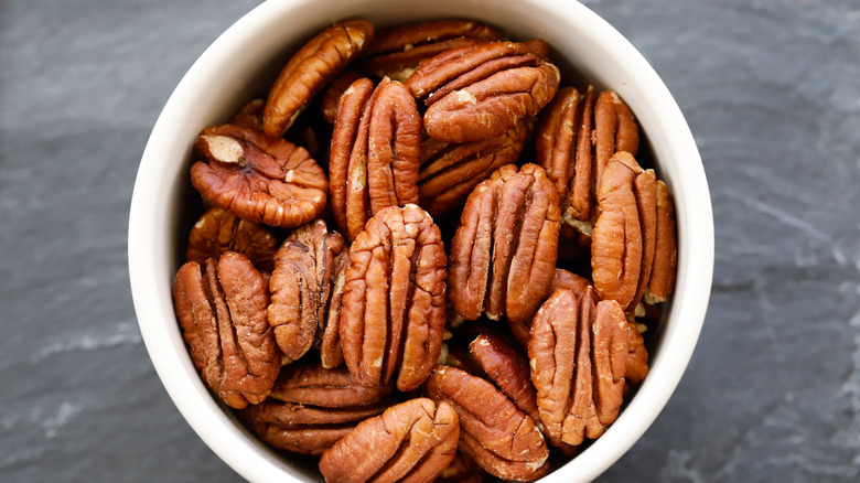 White bowl full of pecans