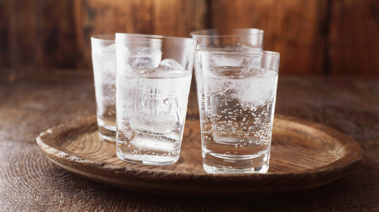 glasses of carbonated water on a tray