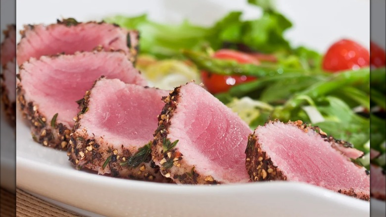 Ahi tuna sliced on a plate for serving