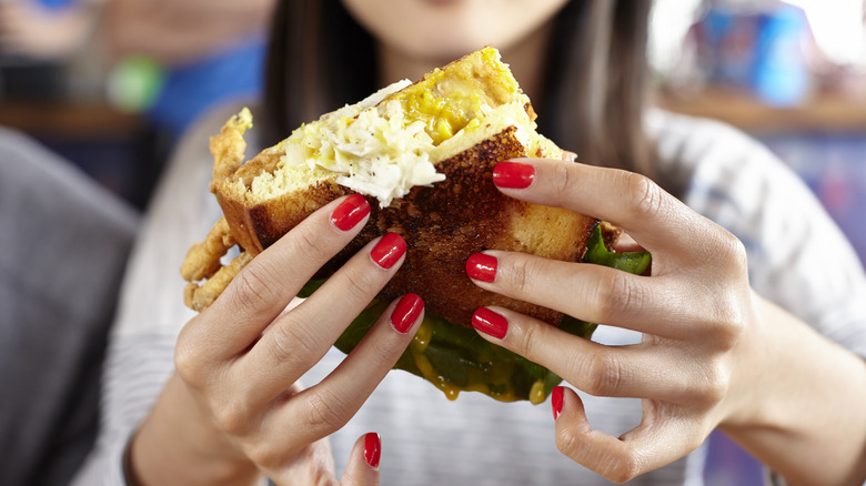 Person eating a sandwich