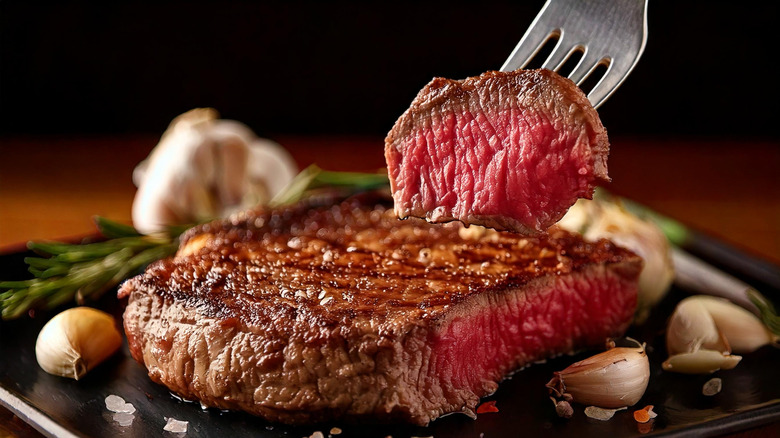 Person eating a steak