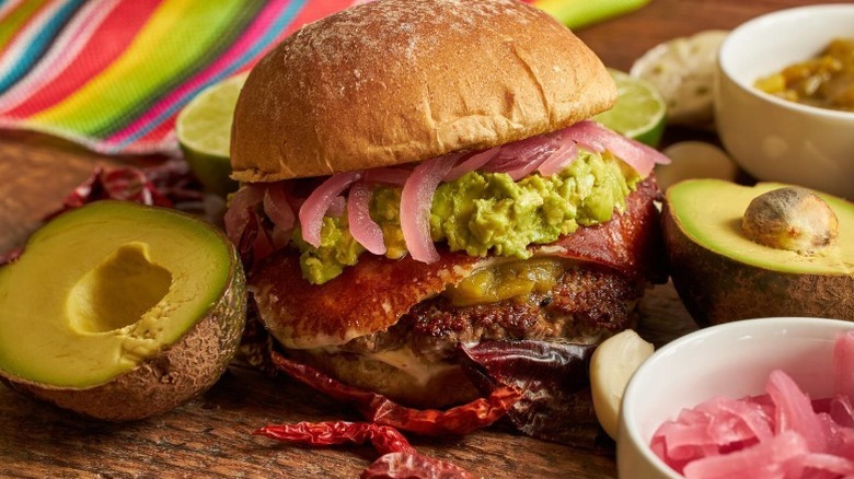 burger with bacon, avocado, and onions