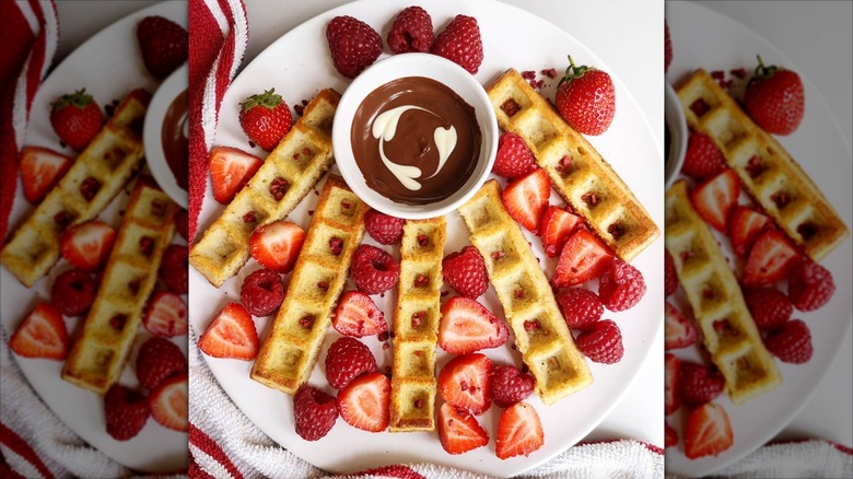 Waffle fries served with berries and chocolate sauce