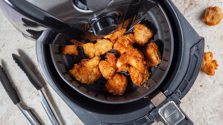 air fryer chicken and tongs