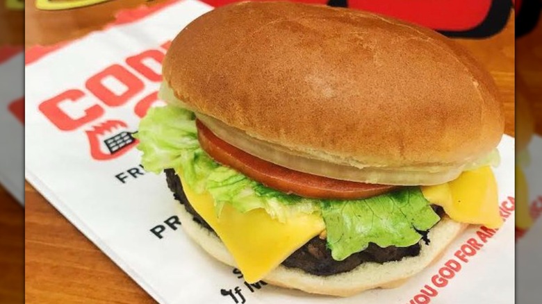 Cook Out burger atop paper wrapper