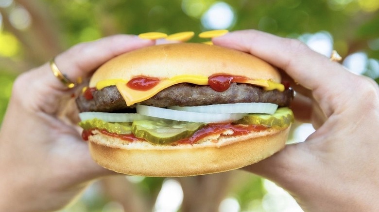 Hardee's burger held in hands