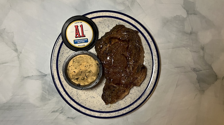 plate with steak and butter