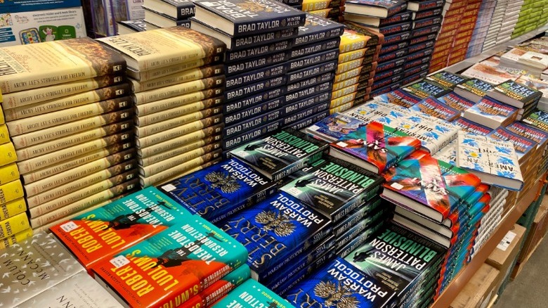 Piles of books at a Costco warehouse location.