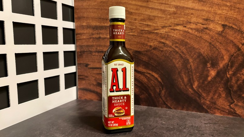 Bottle of A.1. Thick and Hearty Steak Sauce on grey counter