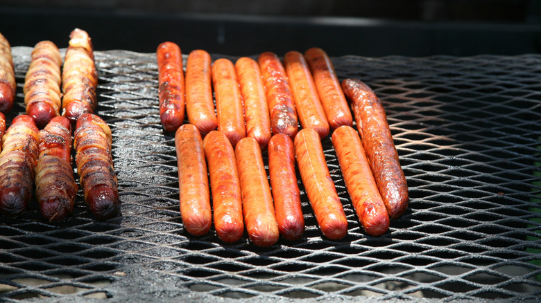 hot dogs on a grill