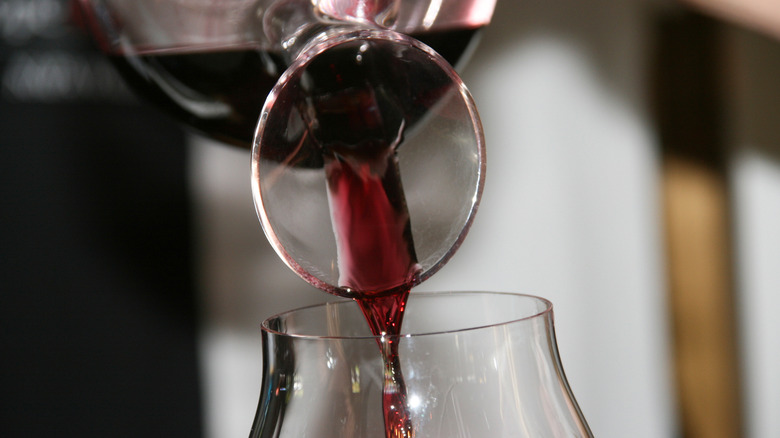 wine being poured from decanter