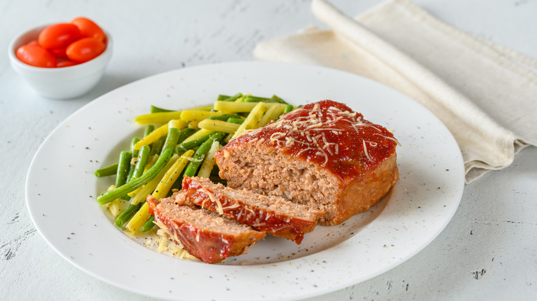 A small meatloaf on a plate