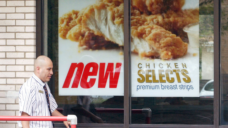 A sign advertising Chicken Selects