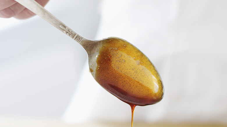 Syrup dripping off a spoon