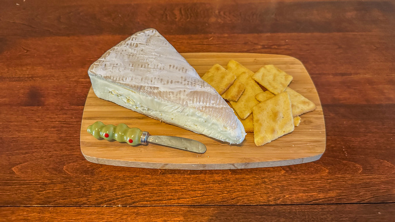 french triple creme brie with calvados from Trader Joe's on cutting board