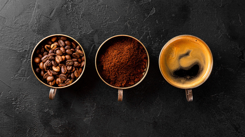 Cups of coffee beans, coffee powder, and brewed coffee