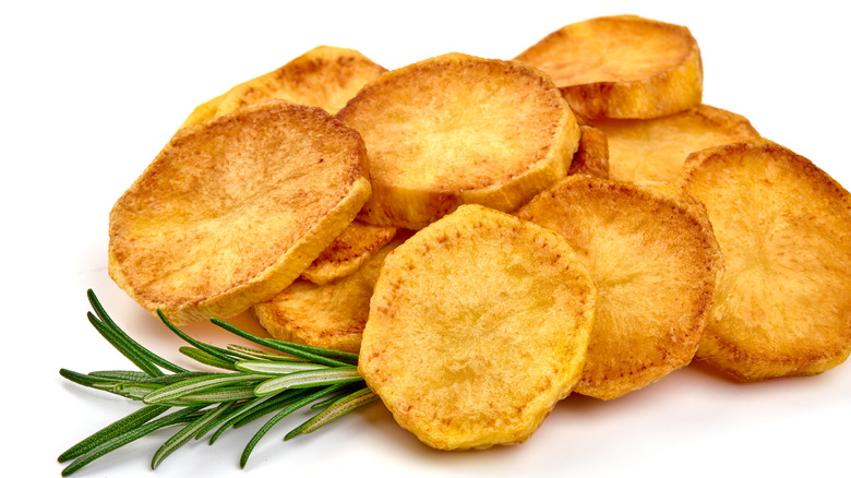 fried potato slices with rosemary