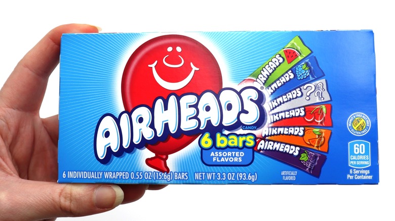 Hand holding Airheads candies