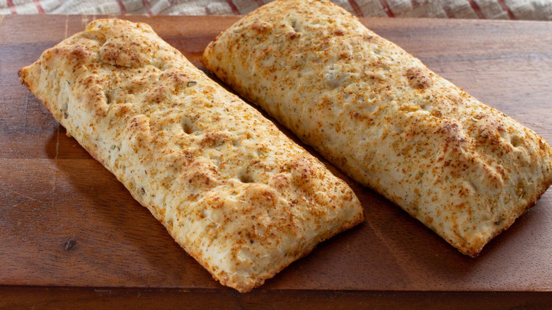 Pizza pockets on a wooden board