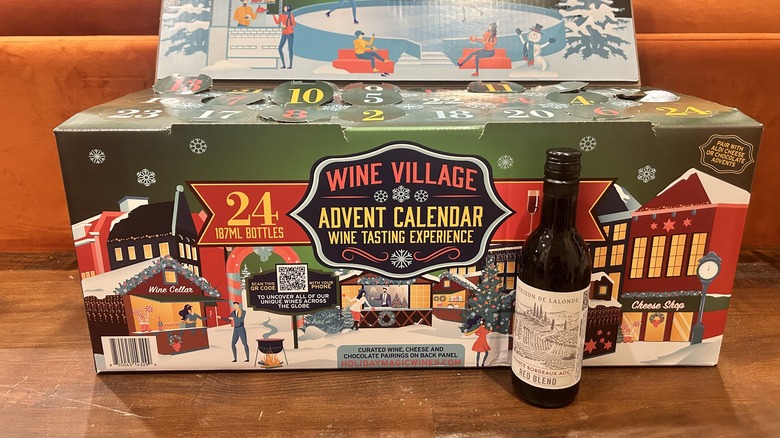 A bottle of French Bordeaux Red Blend in front of Aldi's Advent Calendar