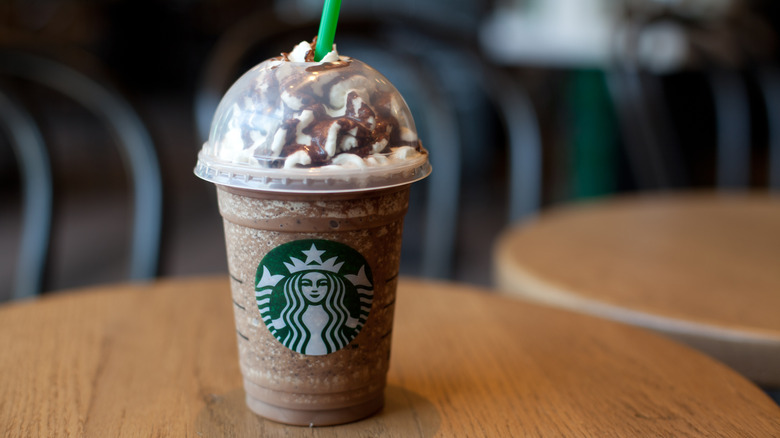 A Starbucks Frappuccino sits on a table