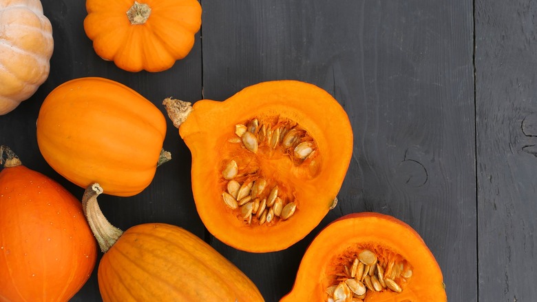 split pumpkins with seeds