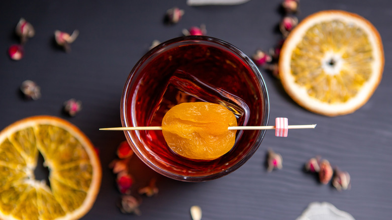 negroni on table with slices of fruit