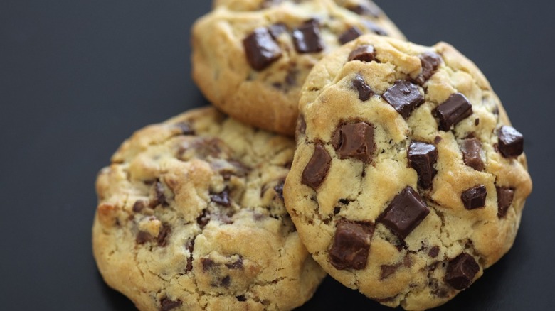 Three thick and chewy chocolate chips cookies