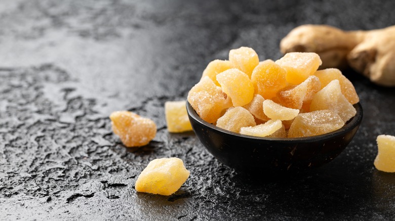 candied ginger in a black bowl